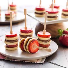 mini sandwiches with strawberries and cream cheese on them are ready to be cut into wedges