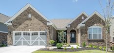 a large brick house with two garages