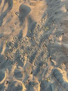 the sand has spiral designs on it and there is no image here to provide a caption for