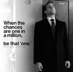 a man in a suit and tie leaning against a wall with a quote on it