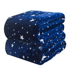 the blue and white stars are folded on top of each other, with one blanket folded over it