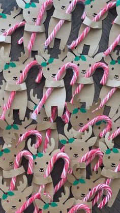 some paper cut out animals with candy canes