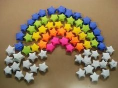 a rainbow made out of small stars on a table