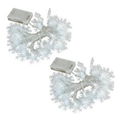 two white christmas lights with frosted branches