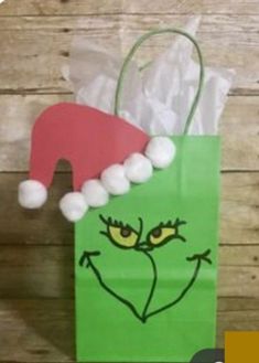 a green bag with a face drawn on it