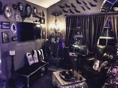 a living room decorated for halloween with bats on the wall