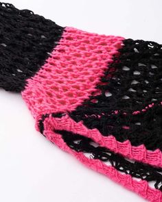 Details: Pink and black long-sleeve crop bolero with crochet materialTop Length: CroppedSleeve Length: Long SleevesMaterials:100% Acrylic Black Open Knit Crop Top For Spring, Black Crochet Top With Knit Fabrication, Black Long Sleeve Crop Top For The Beach, Pink Crochet Long Sleeve Top, Black Long Sleeve Summer Shrug, Hot Pink Cropped Sweater, Pastel Goth Pink Long Sleeve Top, Pink Fitted Cropped Cardigan, Pink Crochet Bolero