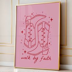 a pink poster with the word walk by faith written in red on it, next to a white wall