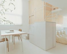 a white table and chairs in a room