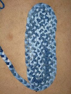 a blue and white piece of cloth on the ground with a string attached to it