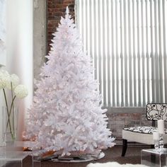 a white christmas tree in a living room