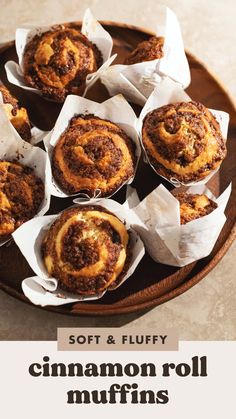 cinnamon roll muffins on a plate with the title soft & fluffy cinnamon roll muffins