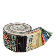 a roll of multicolored fabric with different patterns on the bottom and one side