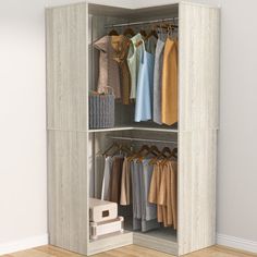 an open closet with clothes hanging on hangers