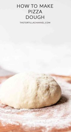 a ball of pizza dough sitting on top of a wooden cutting board with the words how to make pizza dough