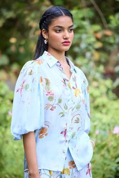 Blue shirt with floral printed motifs. Comes with pant - Aza Fashions Light Blue Floral Print Sets For Spring, Blue Floral Print Sets With Relaxed Fit, Blue Floral Print Short Sleeve Sets, Floral Stand, Diana Penty, Pant For Women, Floral Print Shirt, Satin Color, Pants Pattern