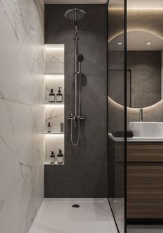 a bathroom with marble walls and flooring, including a walk in shower that has lights on the side