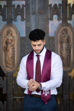 a man wearing a purple tie and white shirt