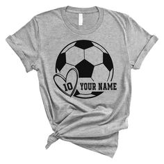 a t - shirt with a soccer ball in the shape of a heart on it