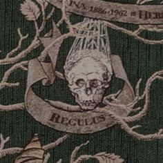 a drawing of a skull with a ribbon around it's neck and banner above it