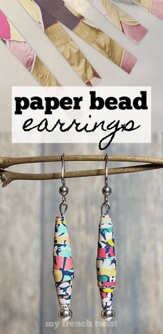 paper bead earrings hanging from a clothes line with text overlay that says paper bead earrings