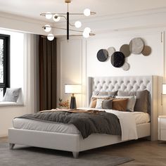 a bedroom with a bed, nightstands and two lamps on either side of the bed