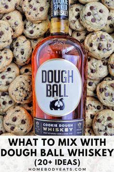 a bottle of dough ball whiskey next to chocolate chip cookies