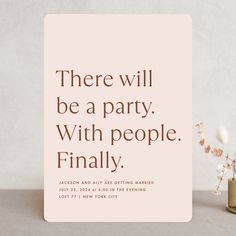 there will be a party with people finally sign next to some flowers on the table