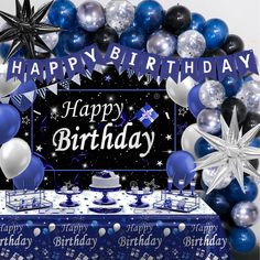 an image of a birthday party with blue and silver balloons on the table for him