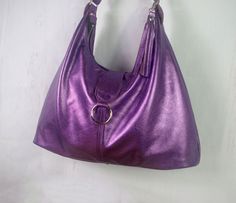 "Hobo in Metallic Purple Leather - NOW with 3 pockets! Now 2 sizes available - Premium leather with designer cotton lining - Now also available with Gunmetal hardware * This bag is handmade from strong, soft metallic leather. * Fully lined in a beautiful designer fabric of your choice (see picture). Or please ask if you would like other options. * 3 inside pockets (including zipper pocket). * One Large compartment. * High quality, double sided, strong adjustable strap. * Strong Bag zipper closur Bag Hardware, Soft Leather Bag, Gunmetal Hardware, Purple Bag, Teal Leather, Hobo Bags, Purple Leather, Purple Bags, Designer Fabric