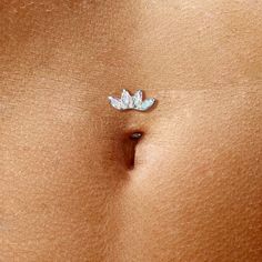 a woman's stomach with a small butterfly on the back of her belly,