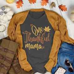 "This \"One Thankful Mama\" t-shirt is the perfect shirt to kick off fall and Thanksgiving. Soft and comfy, this jersey cotton tee looks great with jeans or leggings. Click to snag yours now! Unisex Jersey Cotton Tee SPECIFICATIONS .: Cotton tee .: Light fabric  .: Retail fit .: Runs true to size: Size up for a looser fit or down for a more fitted look.  CARE: .: Turn inside out and machine wash on cold. Do not bleach. Do not iron directly onto the design. PRODUCTION + SHIPPING: .: Printed in th Fall Tshirts, Autumn Shirts, Fall Tees, Tshirts For Women, Thankful Mama, Cute Shirt Designs, Mama T Shirt, Autumn T Shirts, Fall Tee