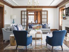 a living room filled with furniture and a fire place