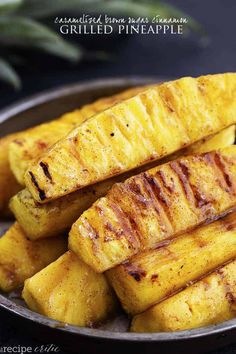 grilled pineapple slices in a bowl on a table