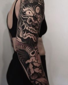 a woman with a dragon tattoo on her arm