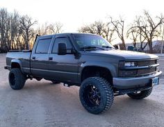 a large gray truck parked in a parking lot