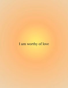 the words i am worthy of love are shown in black on an orange and yellow background