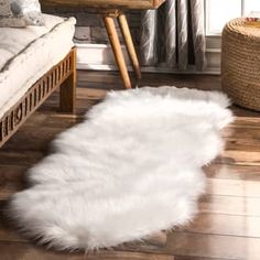 a white sheepskin rug on the floor in a living room