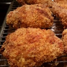 some fried food is cooking on a grill