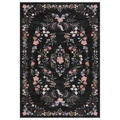 a black rug with flowers and birds on it