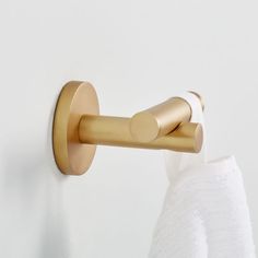 an image of a gold towel holder on the wall