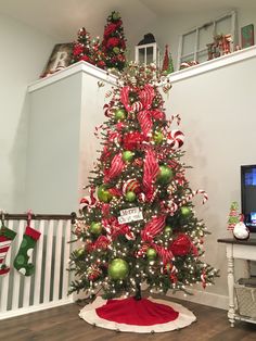 a christmas tree decorated with candy canes and ornaments