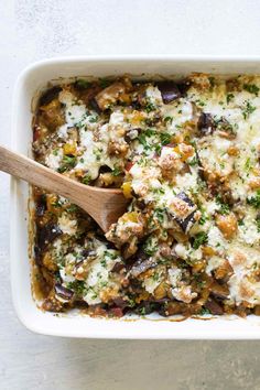 a casserole dish with mushrooms, cheese and parsley