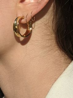 The Rachel Hoops are a beautiful hoop with ornate details, delicate and lightweight enough for daily wear. Featuring curved edges and an open back with stud fastenings. Pair with a classic blouse and everyday denim to add a timeless touch to the look. 14k gold plate over brass & 14k gold-filled posts Made in USA Measurements: 19.3 mm diameter / 22.5 mm width Care: Gold-Plated jewelry can be polished with a soft cotton cloth. We recommend avoiding contact with moisture and removing jewelry pr Chic Hoop Earrings For Everyday Spring Wear, Chic Everyday Hoop Earrings For Spring, Elegant Everyday Spring Hoop Earrings, Elegant Spring Hoop Earrings, Chic Everyday Spring Jewelry, Elegant Hoop Earrings For Summer Wedding, Chic Everyday Hoop Earrings For Summer, Chic Everyday Summer Hoop Earrings, Everyday Spring Earrings