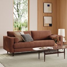 a living room scene with focus on the couch and coffee table