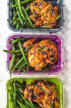 two plastic containers filled with chicken and green beans