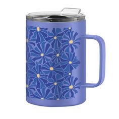 thermos mug with blue flowers on it is shown in front of a white background