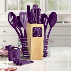 purple kitchen utensils in a basket on a counter