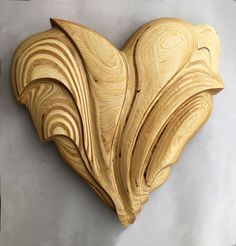 a heart shaped wooden object made out of wood