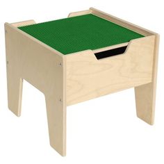 a wooden step stool with a green tray on the bottom and black drawer at the top